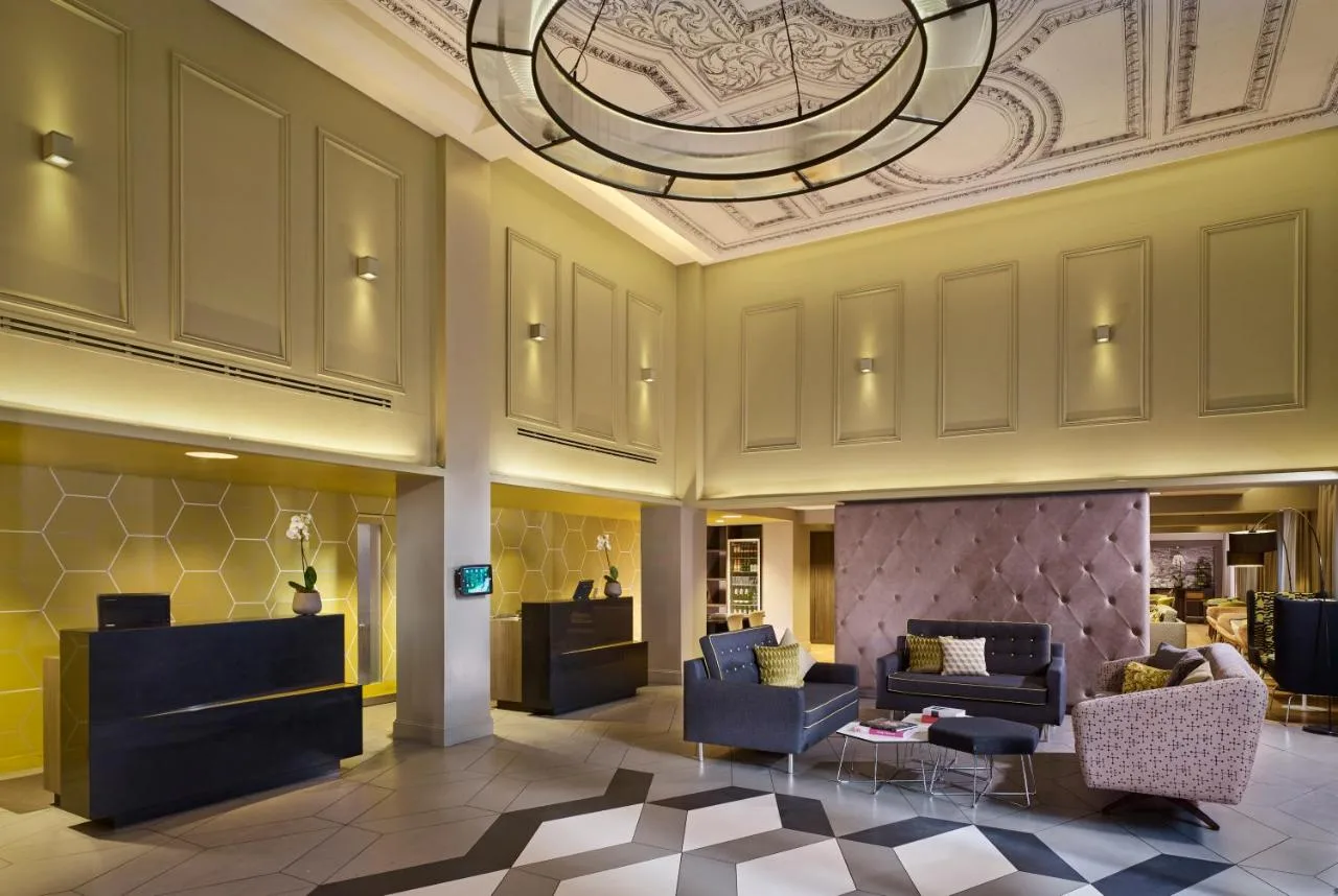 Lobby with couches and chairs at Citadines Trafalgar Square London
