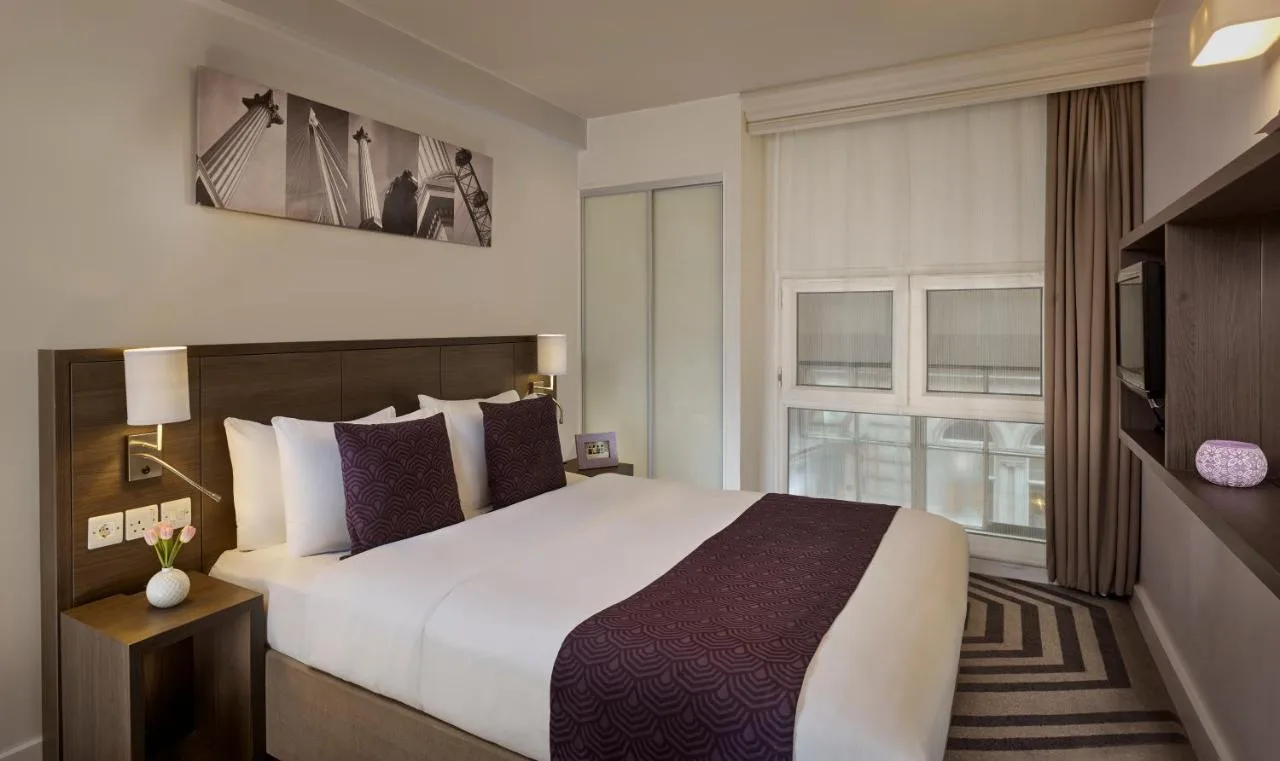 Hotel room with large bed and window