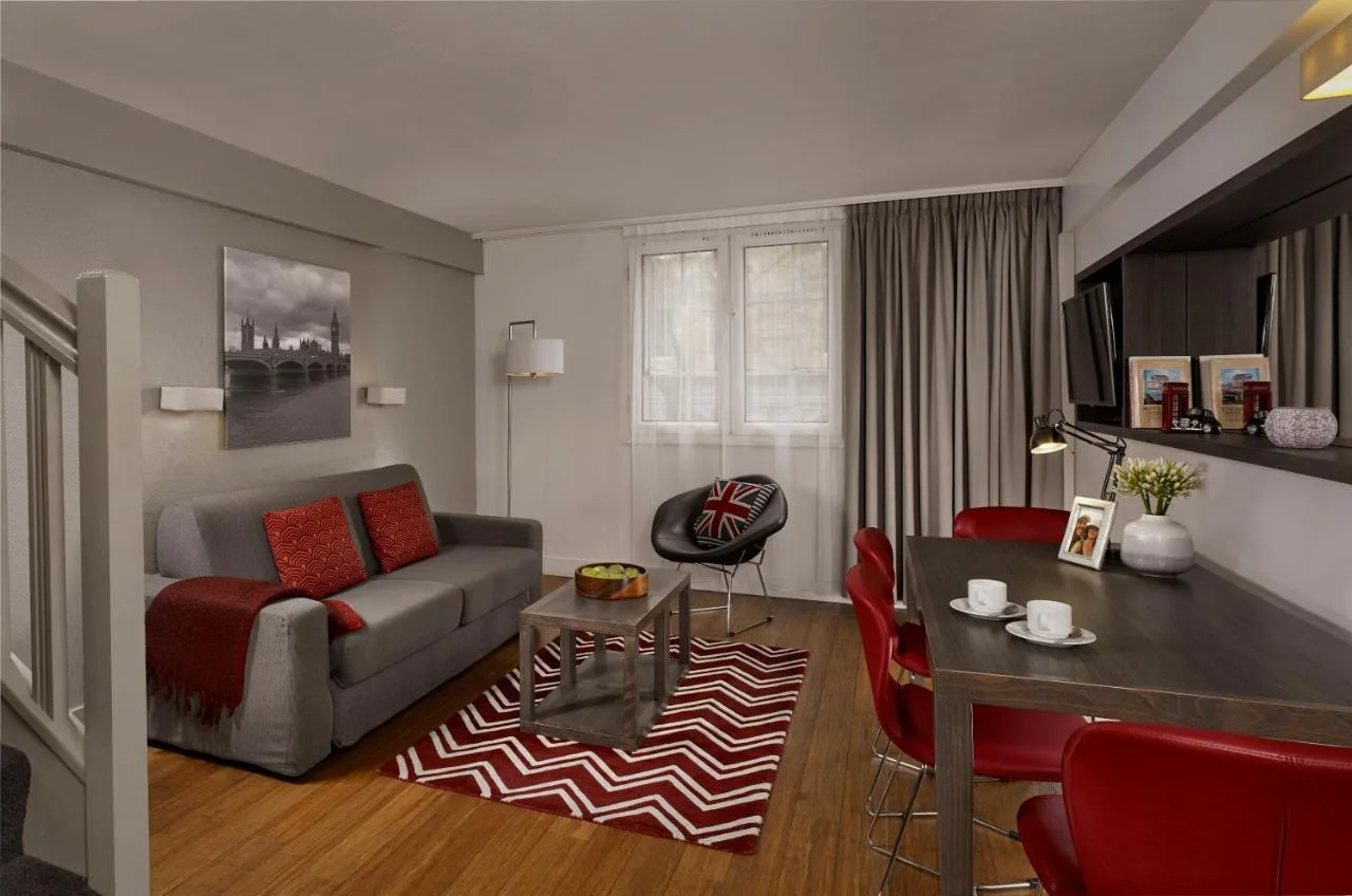 Living room with couch and table in a self-catering apartment