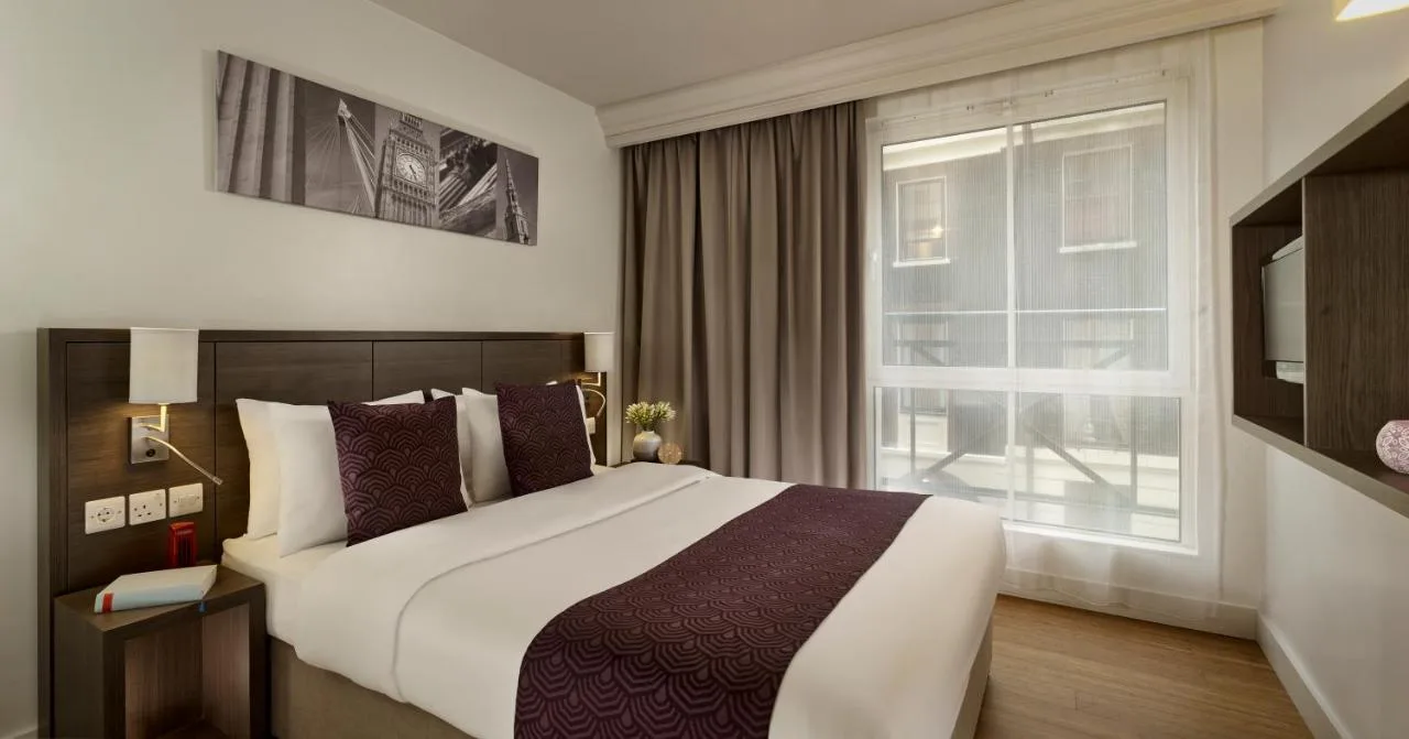Bedroom with large bed and natural light
